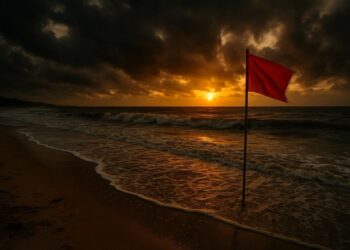 Uma das praias impróprias para banho com uma bandeira vermelha