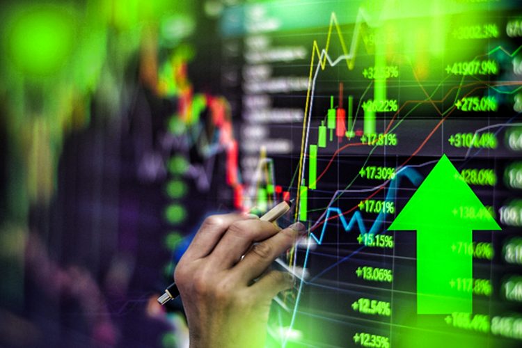 Close-Up Of Hand Analyzing Stock Market Data On Screen
